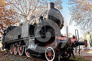 Old steam locomotive on rail on display