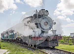 Old steam locomotive or railway train arriving
