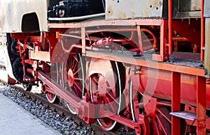 Old steam locomotive wheels close up