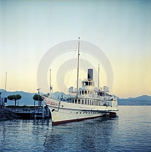 Old steam ship anchored in the marina of Lausanne in Switzerland, shot with analogue color film technique