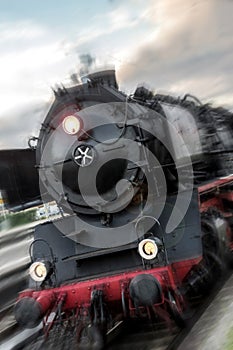 Old steam train speeding