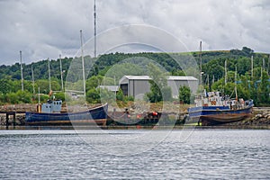 Old steel blue boat moored in the west coast highlands, Scotland