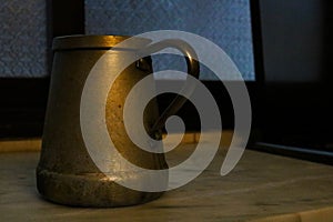 Old steel coffee pot on kitchen counter