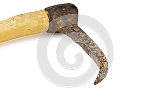 Old steel elephant hook with wooden grip closed up on white