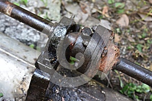 old steel flexible flange and dirty ball bearing on the water pump