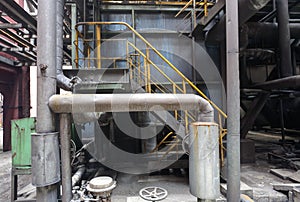 Old steel mill with pipes and valves.