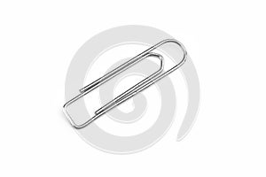 Old steel paper clip isolated on white background