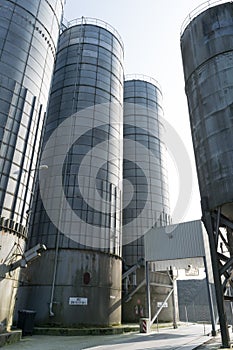 Old steel silos with white cement