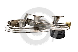 Old steel skates isolated on a white background Hockey puck