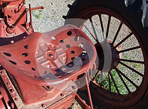 Old steel tractor seat and wheel