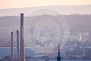 The old steelworks in Ostrowiec and the church in Szewna against the background of the mountains.