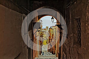 An old, steep staircase between the historic houses photo