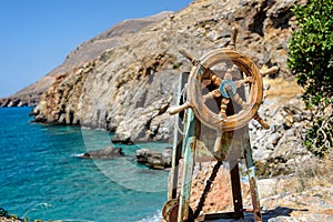 Old steering mechanism located on the rock near Sfakia on Crete island photo