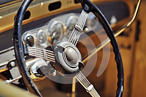 Old steering wheel in a vintage retro car