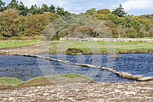 Old stepping stones to cross Ewenny River at Ogmore Castle