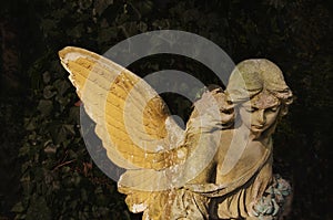 Old stone angel on a light background religion, Christianity, faith concept