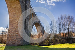 Old stone arched bridge-viaduct. S. Ostriv, Ternopil region, Ukraine photo