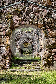 Old stone archway with stone steps of ruins in Jack London state historic park