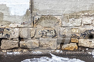 Old stone blocks of the basement of an old house