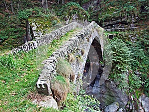 An old stone bridge across the stream Ri d`Alzasca, Magic Valley or Valle Magia Valle Maggia photo