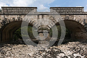 Old stone bridge and dry riverbed