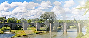 Old stone bridge in France with soft sunlight in summer