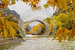 Old stone bridge in Konitsa and Aoos River an autumn day,Epirus, Western Greece