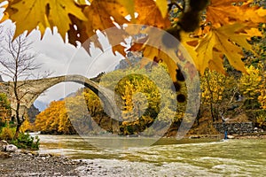 Old stone bridge in Konitsa and Aoos River an autumn day,Epirus, Western Greece