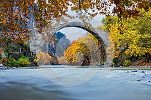 Old stone bridge in Konitsa and Aoos River an autumn day,Epirus, Western Greece. (Soft Focus) Long exposure using ND filter