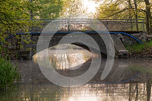 An old stone bridge located in a local park.