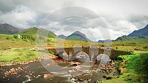 Old stone bridge and Marsco Peak in Sligachan, Scotland