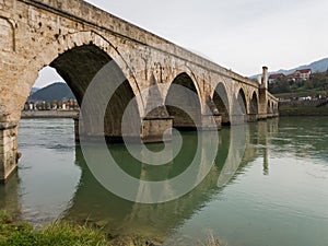 The old stone bridge of Mehmed Pasha Sokolovic over the river Drina in Visegrad