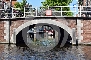 An old stone bridge over a canal in the center of Haarlem, the Netherlands