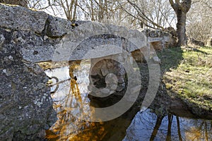 Old stone bridge over a river