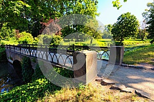 Old stone bridge over the stream. Nature landscape of picturesque Arboretum Oleksandriya in Bila Tserkva.