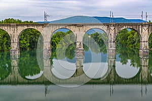 Old stone bridge reflection in the water