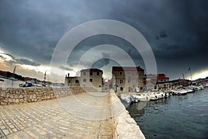 Old stone bridge and storm in Croatia