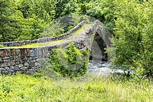 Old Stone bridge in summer - Pyrenees. Andorra la Vella. Andorr