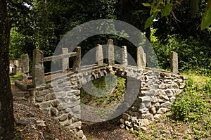 Old stone bridge in the park photo