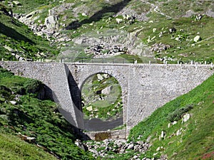 Old stone bridges over alpine streams on the alpine mountain St. Gotthard Pass Gotthardpass, Airolo - Canton of Ticino Tessin