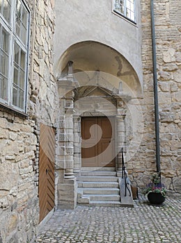 A old stone building with doors and stairsteps
