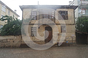 Old, stone buildings in the countryside.