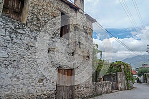 Old, stone buildings in the countryside.