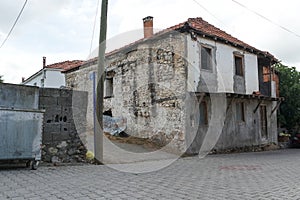 Old, stone buildings in the countryside.