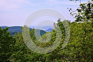 Old stone castle ruins in forest. hot summer day