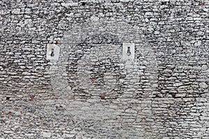 Old stone castle wall texture, cannon windows