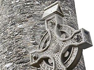 Old stone celtic cross in a traditional irish graveyard