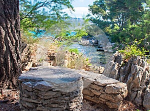Old stone and chairs made from rocks hidden