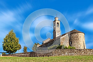 Old stone church under blue sky.