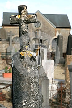 Old stone cross at a churchyard